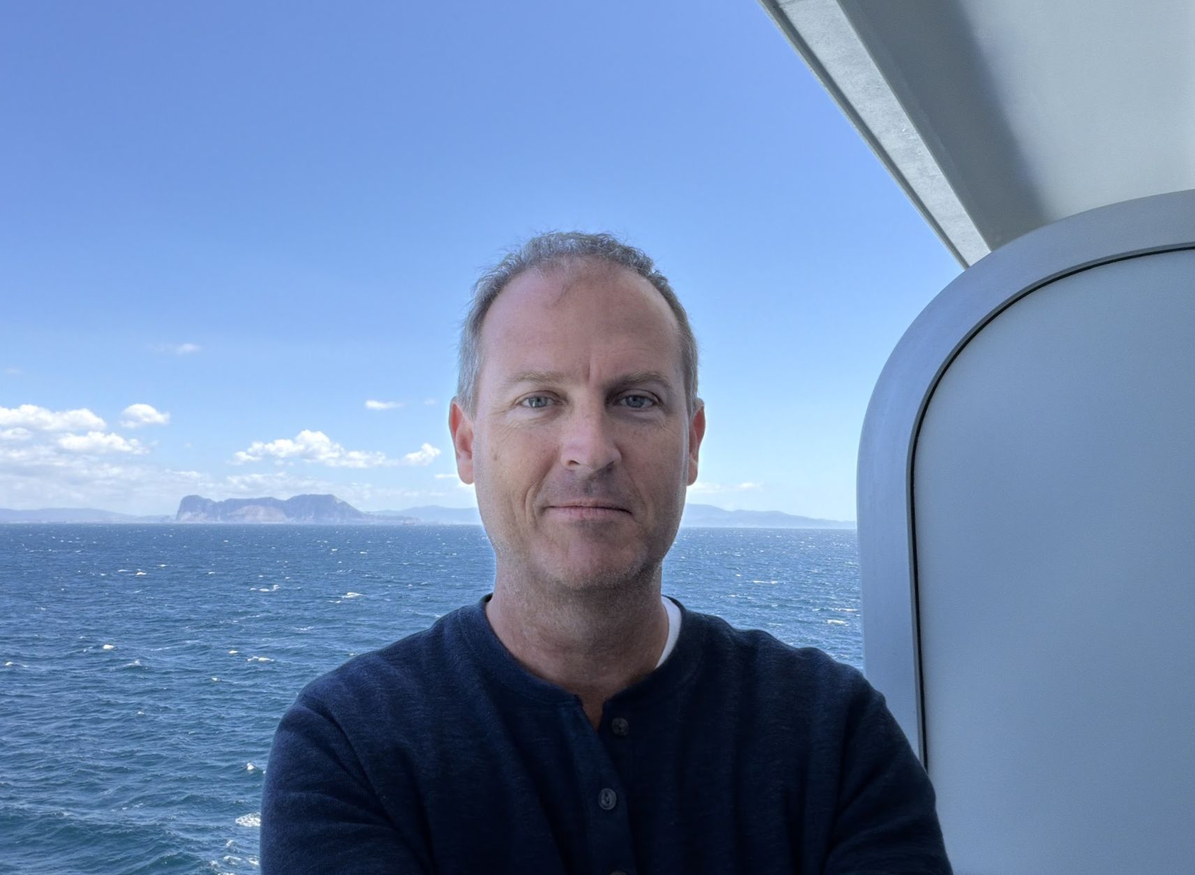 Brian Hart, founder of Serentis Travel, on deck approaching Gibraltar
